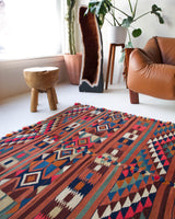 Vintage kilim rug in living room setting, bright colors, wild shaman, soft rug, bold color, Portland, Oregon, rug store, rug shop, local shop, vintage rug, modern kilim