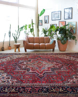 Antique Persian area rug in a living room setting, pile rug, vintage rug, portland, rug shop, bright colors, wild shaman, soft rug, bold color, Portland, Oregon, rug store, rug shop, local shop, antique rug, Persian rug, handmade rug, wool rug