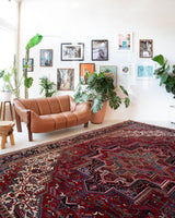 Antique Persian area rug in a living room setting, pile rug, vintage rug, portland, rug shop, bright colors, wild shaman, soft rug, bold color, Portland, Oregon, rug store, rug shop, local shop, antique rug, Persian rug, handmade rug, wool rug