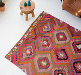 Vintage kilim rug in living room setting, bright colors, wild shaman, soft rug, bold color, Portland, Oregon, rug store, rug shop, local shop, vintage rug, modern kilim