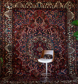 Antique Persian area rug in a living room setting, pile rug, vintage rug, portland, rug shop, bright colors, wild shaman, soft rug, bold color, Portland, Oregon, rug store, rug shop, local shop, antique rug, Persian rug, handmade rug, wool rug