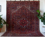 Antique Persian area rug in a living room setting, pile rug, vintage rug, portland, rug shop, bright colors, wild shaman, soft rug, bold color, Portland, Oregon, rug store, rug shop, local shop, antique rug, Persian rug, handmade rug, wool rug