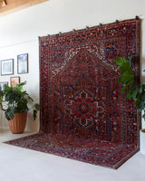 Antique Persian area rug in a living room setting, pile rug, vintage rug, portland, rug shop, bright colors, wild shaman, soft rug, bold color, Portland, Oregon, rug store, rug shop, local shop, antique rug, Persian rug, handmade rug, wool rug