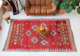 Vintage kilim rug in living room setting, bright colors, wild shaman, soft rug, bold color, Portland, Oregon, rug store, rug shop, local shop, vintage rug, modern kilim