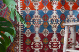 Antique kilim rug in living room setting, bright colors, wild shaman, soft rug, bold color, Portland, Oregon, rug store, rug shop, local shop, vintage rug, modern kilim, antique kilim, antique