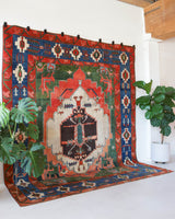Vintage Turkish rug in a living room setting, pile rug, Turkish rug, vintage rug, portland, rug shop, bright colors, wild shaman, soft rug, bold color, Portland, Oregon, rug store, rug shop, local shop