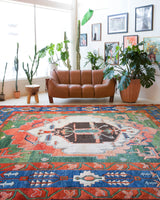 Vintage Turkish rug in a living room setting, pile rug, Turkish rug, vintage rug, portland, rug shop, bright colors, wild shaman, soft rug, bold color, Portland, Oregon, rug store, rug shop, local shop