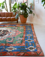Vintage Turkish rug in a living room setting, pile rug, Turkish rug, vintage rug, portland, rug shop, bright colors, wild shaman, soft rug, bold color, Portland, Oregon, rug store, rug shop, local shop