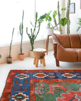 Vintage Turkish rug in a living room setting, pile rug, Turkish rug, vintage rug, portland, rug shop, bright colors, wild shaman, soft rug, bold color, Portland, Oregon, rug store, rug shop, local shop