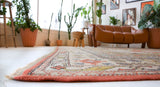 Vintage Turkish rug in living room setting, old rug, antique rug, pastel colors, faded colors, Turkish rug, vintage rug, soft rug, Portland, Oregon, rug store, rug shop, local shop