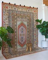 Vintage Turkish rug in living room setting, old rug, antique rug, pastel colors, faded colors, Turkish rug, vintage rug, soft rug, Portland, Oregon, rug store, rug shop, local shop