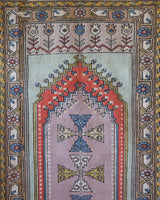 Vintage Turkish rug in living room setting, old rug, antique rug, pastel colors, faded colors, Turkish rug, vintage rug, soft rug, Portland, Oregon, rug store, rug shop, local shop