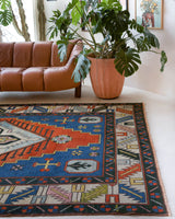 Area rug in a living room setting, pile rug, Turkish rug, custom rug, , new rug, modern rug, customizable rug, made to order rug, portland, rug shop, bright colors, wild shaman, soft rug, bold color, Portland, Oregon, rug store, rug shop, local shop, made in Turkey