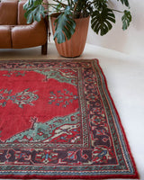 Vintage Turkish rug in a living room setting, pile rug, Turkish rug, vintage rug, portland, rug shop, bright colors, wild shaman, soft rug, bold color, Portland, Oregon, rug store, rug shop, local shop, antique rug