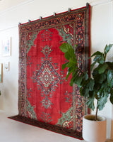 Vintage Turkish rug in a living room setting, pile rug, Turkish rug, vintage rug, portland, rug shop, bright colors, wild shaman, soft rug, bold color, Portland, Oregon, rug store, rug shop, local shop, antique rug