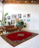 Vintage Turkish rug in a living room setting, pile rug, Turkish rug, vintage rug, portland, rug shop, bright colors, wild shaman, soft rug, bold color, Portland, Oregon, rug store, rug shop, local shop, antique rug