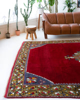 Vintage Turkish rug in a living room setting, pile rug, Turkish rug, vintage rug, portland, rug shop, bright colors, wild shaman, soft rug, bold color, Portland, Oregon, rug store, rug shop, local shop, antique rug