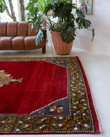 Vintage Turkish rug in a living room setting, pile rug, Turkish rug, vintage rug, portland, rug shop, bright colors, wild shaman, soft rug, bold color, Portland, Oregon, rug store, rug shop, local shop, antique rug