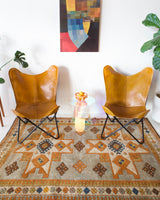 Vintage caucasian rug in a living room setting, pastel colors, faded colors, Turkish rug, vintage rug, soft rug, Portland, Oregon, rug store, rug shop, local shop