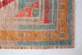 Area rug in a living room setting, pile rug, Turkish rug, old rug, antique rug, pastel colors, faded colors, Turkish rug, vintage rug, soft rug, Portland, Oregon, rug store, rug shop, local shop, distressed rug, worn out rug