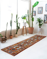 Vintage Turkish runner rug in a living room setting, pile rug, Turkish rug, vintage rug, portland, rug shop, bright colors, wild shaman, soft rug, bold color, Portland, Oregon, rug store, rug shop, local shop, antique rug