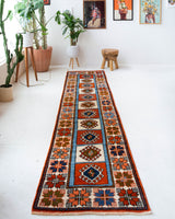 Vintage Turkish runner rug in a living room setting, pile rug, Turkish rug, vintage rug, portland, rug shop, bright colors, wild shaman, soft rug, bold color, Portland, Oregon, rug store, rug shop, local shop, antique rug