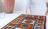 Vintage Turkish runner rug in a living room setting, pile rug, Turkish rug, vintage rug, portland, rug shop, bright colors, wild shaman, soft rug, bold color, Portland, Oregon, rug store, rug shop, local shop, antique rug
