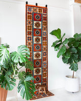 Vintage Turkish runner rug in a living room setting, pile rug, Turkish rug, vintage rug, portland, rug shop, bright colors, wild shaman, soft rug, bold color, Portland, Oregon, rug store, rug shop, local shop, antique rug