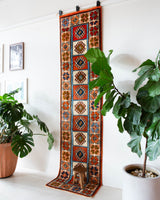 Vintage Turkish runner rug in a living room setting, pile rug, Turkish rug, vintage rug, portland, rug shop, bright colors, wild shaman, soft rug, bold color, Portland, Oregon, rug store, rug shop, local shop, antique rug