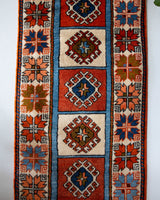 Vintage Turkish runner rug in a living room setting, pile rug, Turkish rug, vintage rug, portland, rug shop, bright colors, wild shaman, soft rug, bold color, Portland, Oregon, rug store, rug shop, local shop, antique rug