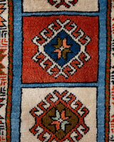 Vintage Turkish runner rug in a living room setting, pile rug, Turkish rug, vintage rug, portland, rug shop, bright colors, wild shaman, soft rug, bold color, Portland, Oregon, rug store, rug shop, local shop, antique rug