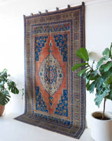 Vintage Turkish rug in a living room setting, pile rug, Turkish rug, vintage rug, portland, rug shop, bright colors, wild shaman, soft rug, bold color, Portland, Oregon, rug store, rug shop, local shop, antique rug