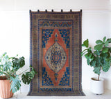 Vintage Turkish rug in a living room setting, pile rug, Turkish rug, vintage rug, portland, rug shop, bright colors, wild shaman, soft rug, bold color, Portland, Oregon, rug store, rug shop, local shop, antique rug