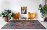 Vintage Turkish rug in a living room setting, pile rug, Turkish rug, vintage rug, portland, rug shop, bright colors, wild shaman, soft rug, bold color, Portland, Oregon, rug store, rug shop, local shop, antique rug
