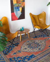 Vintage Turkish rug in a living room setting, pile rug, Turkish rug, vintage rug, portland, rug shop, bright colors, wild shaman, soft rug, bold color, Portland, Oregon, rug store, rug shop, local shop, antique rug