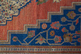 Vintage Turkish rug in a living room setting, pile rug, Turkish rug, vintage rug, portland, rug shop, bright colors, wild shaman, soft rug, bold color, Portland, Oregon, rug store, rug shop, local shop, antique rug