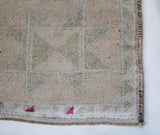 Vintage Turkish runner rug in living room setting, old rug, antique rug, pastel colors, faded colors, Turkish rug, vintage rug, soft rug, Portland, Oregon, rug store, rug shop, local shop