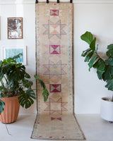 Vintage Turkish runner rug in living room setting, old rug, antique rug, pastel colors, faded colors, Turkish rug, vintage rug, soft rug, Portland, Oregon, rug store, rug shop, local shop