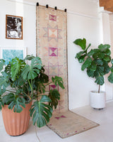 Vintage Turkish runner rug in living room setting, old rug, antique rug, pastel colors, faded colors, Turkish rug, vintage rug, soft rug, Portland, Oregon, rug store, rug shop, local shop