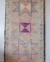 Vintage Turkish runner rug in living room setting, old rug, antique rug, pastel colors, faded colors, Turkish rug, vintage rug, soft rug, Portland, Oregon, rug store, rug shop, local shop