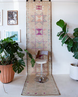 Vintage Turkish runner rug in living room setting, old rug, antique rug, pastel colors, faded colors, Turkish rug, vintage rug, soft rug, Portland, Oregon, rug store, rug shop, local shop