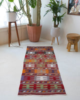 Vintage Turkish runner rug in a living room setting, pile rug, Turkish rug, vintage rug, portland, rug shop, bright colors, wild shaman, soft rug, bold color, Portland, Oregon, rug store, rug shop, local shop, antique rug