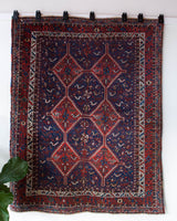 Vintage Persian rug in a living room setting, pile rug, Turkish rug, vintage rug, portland, rug shop, bright colors, wild shaman, soft rug, bold color, Portland, Oregon, rug store, rug shop, local shop, antique rug