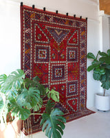 Vintage Turkish rug in a living room setting, pile rug, Turkish rug, vintage rug, portland, rug shop, bright colors, wild shaman, soft rug, bold color, Portland, Oregon, rug store, rug shop, local shop, antique rug