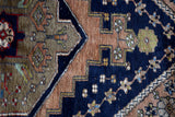 Vintage Turkish rug in living room setting, old rug, antique rug, pastel colors, faded colors, Turkish rug, vintage rug, soft rug, Portland, Oregon, rug store, rug shop, local shop
