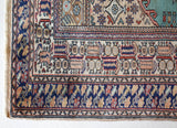 Small area rug in a living room setting, pile rug, Turkish rug, old rug, antique rug, pastel colors, faded colors, Turkish rug, vintage rug, soft rug, Portland, Oregon, rug store, rug shop, local shop, cool colors