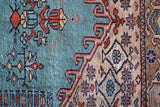 Small area rug in a living room setting, pile rug, Turkish rug, old rug, antique rug, pastel colors, faded colors, Turkish rug, vintage rug, soft rug, Portland, Oregon, rug store, rug shop, local shop, cool colors