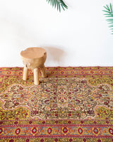 Vintage Turkish rug in a living room setting, pile rug, Turkish rug, vintage rug, portland, rug shop, bright colors, wild shaman, soft rug, bold color, Portland, Oregon, rug store, rug shop, local shop, antique rug, floral rug