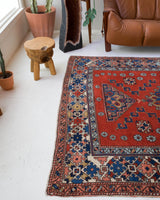 Vintage Turkish rug in a living room setting, pile rug, Turkish rug, vintage rug, portland, rug shop, bright colors, wild shaman, soft rug, bold color, Portland, Oregon, rug store, rug shop, local shop, antique rug