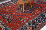 Vintage Turkish rug in a living room setting, pile rug, Turkish rug, vintage rug, portland, rug shop, bright colors, wild shaman, soft rug, bold color, Portland, Oregon, rug store, rug shop, local shop, antique rug